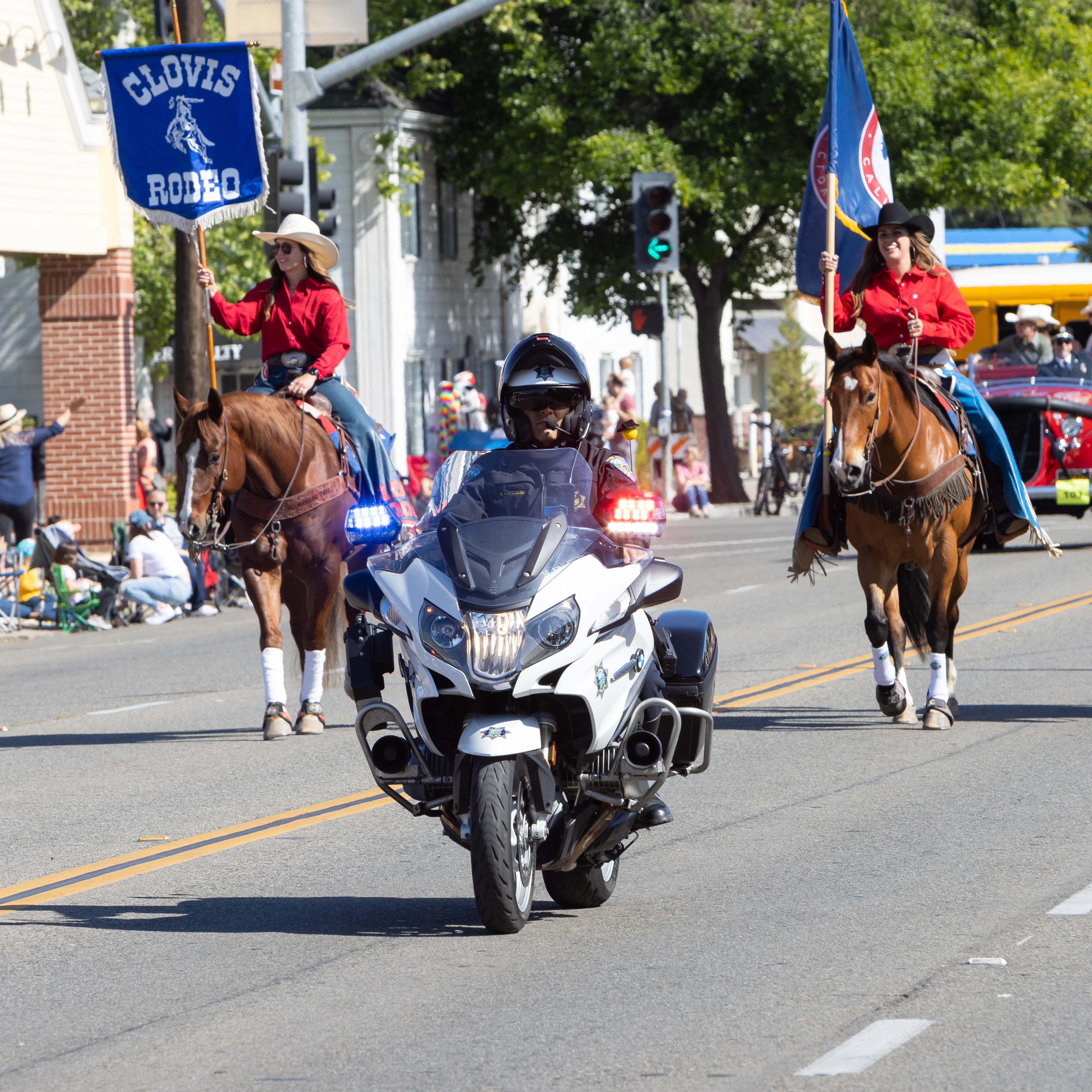 Clovis police officer on motorcycle escorting the Clovis Rodeo parade